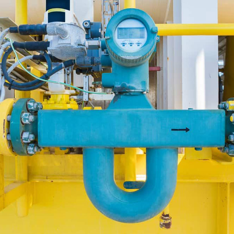 Industrial flow measurement instrument installed on pipeline monitoring liquid and gas flow rate for process control